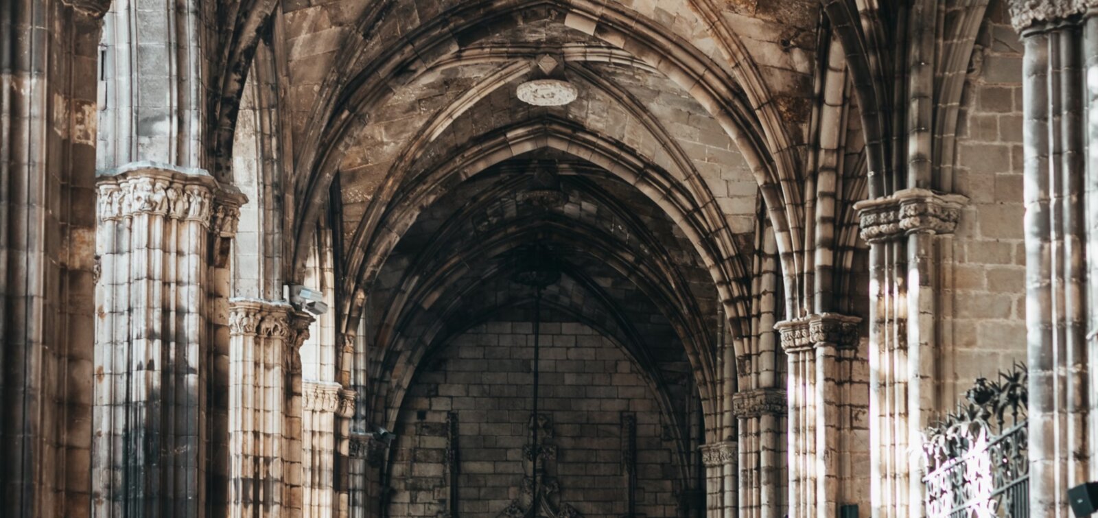 Gothic cathedral interior with soaring stone arches and columns